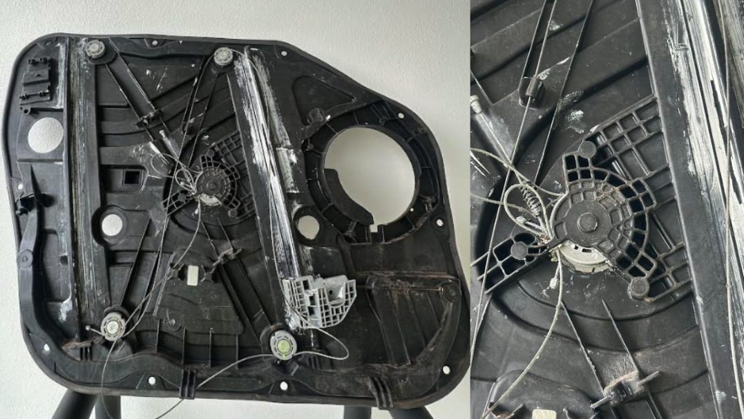 Close-up of a Hyundai Tucson window regulator failure from worn cables